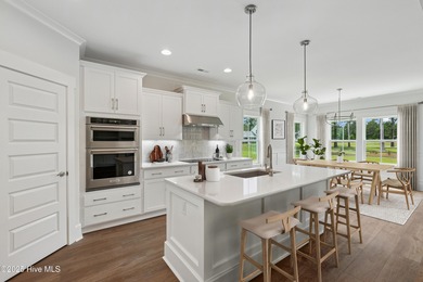 Discover the Skiff, a beautiful new Logan Home, located in on Sea Trail Golf Resort in North Carolina - for sale on GolfHomes.com, golf home, golf lot