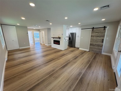 This completely renovated extraordinary Greenbriar model end on Leisure Village Golf Course in New York - for sale on GolfHomes.com, golf home, golf lot