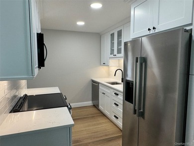 This completely renovated extraordinary Greenbriar model end on Leisure Village Golf Course in New York - for sale on GolfHomes.com, golf home, golf lot