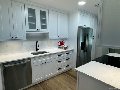 This completely renovated extraordinary Greenbriar model end on Leisure Village Golf Course in New York - for sale on GolfHomes.com, golf home, golf lot