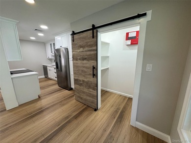 This completely renovated extraordinary Greenbriar model end on Leisure Village Golf Course in New York - for sale on GolfHomes.com, golf home, golf lot