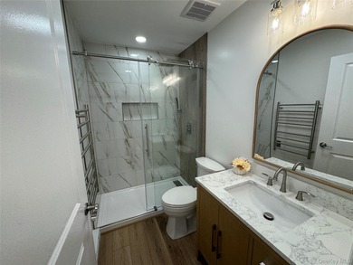 This completely renovated extraordinary Greenbriar model end on Leisure Village Golf Course in New York - for sale on GolfHomes.com, golf home, golf lot