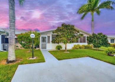 Discover this charming 2-bedroom, 2-bathroom villa in the on Cypress Lakes Golf Course - West Palm Beach in Florida - for sale on GolfHomes.com, golf home, golf lot