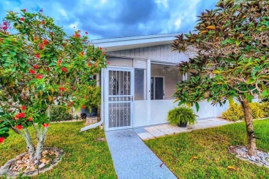 Discover this charming 2-bedroom, 2-bathroom villa in the on Cypress Lakes Golf Course - West Palm Beach in Florida - for sale on GolfHomes.com, golf home, golf lot