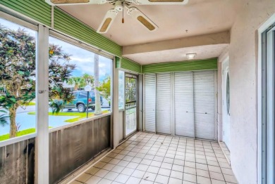 Discover this charming 2-bedroom, 2-bathroom villa in the on Cypress Lakes Golf Course - West Palm Beach in Florida - for sale on GolfHomes.com, golf home, golf lot