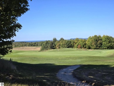 This prime hill top lot provides sweeping views of Champion Hill on Champion Hill Golf Club in Michigan - for sale on GolfHomes.com, golf home, golf lot