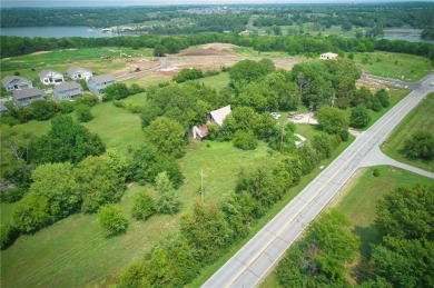 Commercial land with house and barn that has gone through the on Lakeside Hills Golf Course in Kansas - for sale on GolfHomes.com, golf home, golf lot