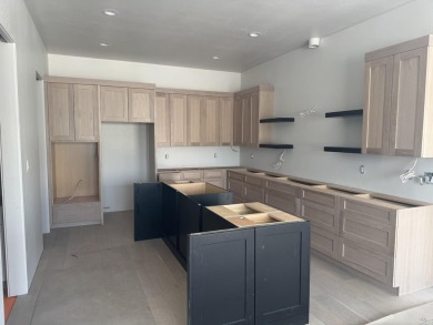 Discover the epitome of low-maintenance luxury in this stunning on The Golf Club At Redlands Mesa in Colorado - for sale on GolfHomes.com, golf home, golf lot