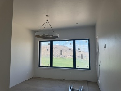 Discover the epitome of low-maintenance luxury in this stunning on The Golf Club At Redlands Mesa in Colorado - for sale on GolfHomes.com, golf home, golf lot