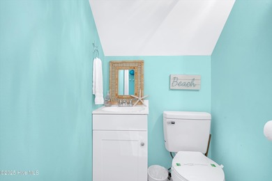 Welcome to 122 SE 2nd Street-Your Coastal Retreat Awaits! This on Founders Club At St. James Plantation in North Carolina - for sale on GolfHomes.com, golf home, golf lot