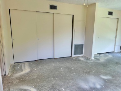This rare 1 bed/1 bath, first floor end unit is waiting for you on On Top Of The World Golf Course in Florida - for sale on GolfHomes.com, golf home, golf lot