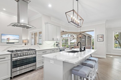 Experience refined coastal living at 463 Captains Circle, a on Regatta Bay Golf and Country Club in Florida - for sale on GolfHomes.com, golf home, golf lot