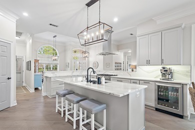 Experience refined coastal living at 463 Captains Circle, a on Regatta Bay Golf and Country Club in Florida - for sale on GolfHomes.com, golf home, golf lot