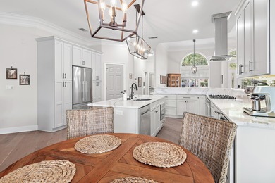 Experience refined coastal living at 463 Captains Circle, a on Regatta Bay Golf and Country Club in Florida - for sale on GolfHomes.com, golf home, golf lot