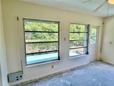 This rare 1 bed/1 bath, first floor end unit is waiting for you on On Top Of The World Golf Course in Florida - for sale on GolfHomes.com, golf home, golf lot
