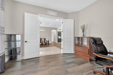 Experience the best of modern Florida living in this custom on Palm Harbor Golf Club in Florida - for sale on GolfHomes.com, golf home, golf lot
