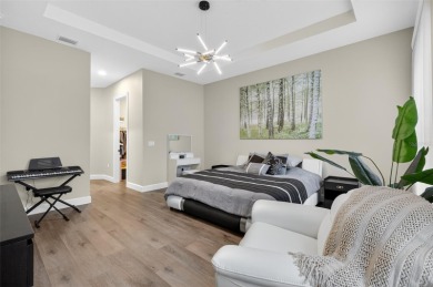 Experience the best of modern Florida living in this custom on Palm Harbor Golf Club in Florida - for sale on GolfHomes.com, golf home, golf lot