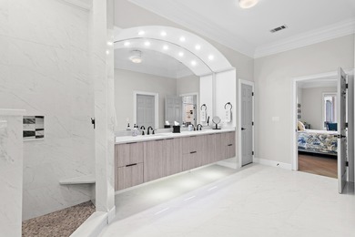 Experience refined coastal living at 463 Captains Circle, a on Regatta Bay Golf and Country Club in Florida - for sale on GolfHomes.com, golf home, golf lot