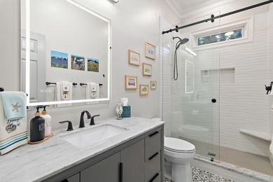 Experience refined coastal living at 463 Captains Circle, a on Regatta Bay Golf and Country Club in Florida - for sale on GolfHomes.com, golf home, golf lot