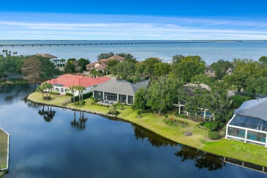 Experience refined coastal living at 463 Captains Circle, a on Regatta Bay Golf and Country Club in Florida - for sale on GolfHomes.com, golf home, golf lot