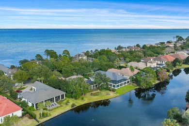 Experience refined coastal living at 463 Captains Circle, a on Regatta Bay Golf and Country Club in Florida - for sale on GolfHomes.com, golf home, golf lot