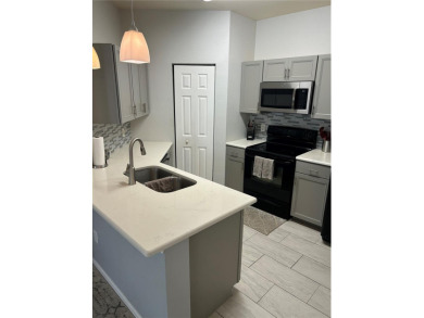Move in ready ground floor corner unit in highly desirable on Innisbrook Resort and Golf Club in Florida - for sale on GolfHomes.com, golf home, golf lot