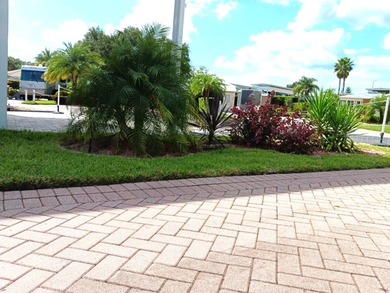This nicely landscaped vacant property is located in the 55+ on Deer Creek RV Golf Resort in Florida - for sale on GolfHomes.com, golf home, golf lot