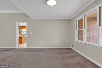 Welcome to this expansive four-sided brick ranch home situated on Lake Spivey Golf Club in Georgia - for sale on GolfHomes.com, golf home, golf lot