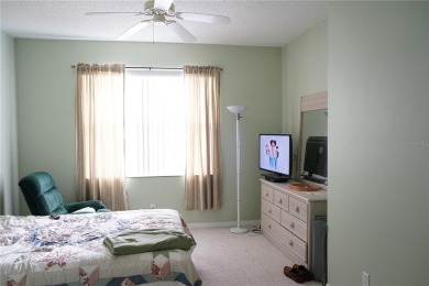 Original snow bird owners in this 2001 attached condo located in on Scepter Golf Club in Florida - for sale on GolfHomes.com, golf home, golf lot