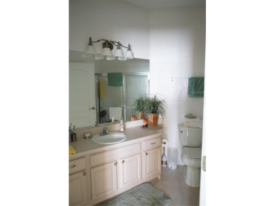 Original snow bird owners in this 2001 attached condo located in on Scepter Golf Club in Florida - for sale on GolfHomes.com, golf home, golf lot