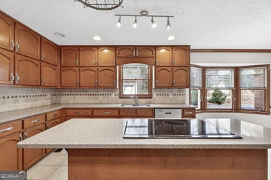 Welcome to this expansive four-sided brick ranch home situated on Lake Spivey Golf Club in Georgia - for sale on GolfHomes.com, golf home, golf lot