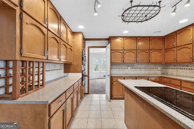 Welcome to this expansive four-sided brick ranch home situated on Lake Spivey Golf Club in Georgia - for sale on GolfHomes.com, golf home, golf lot