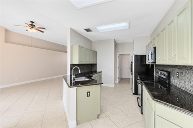 One or more of the listing photos has been digitally staged on Twin Rivers Golf Club in Florida - for sale on GolfHomes.com, golf home, golf lot