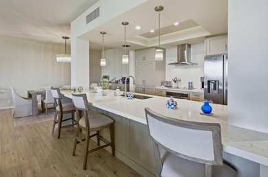 You will enjoy a very open floor plan with newer wide plank tile on Desert Island Golf and Country Club in California - for sale on GolfHomes.com, golf home, golf lot