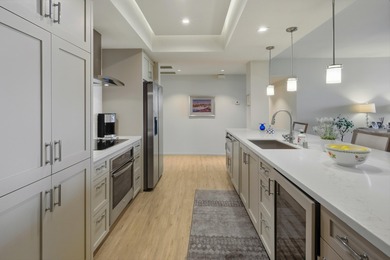 You will enjoy a very open floor plan with newer wide plank tile on Desert Island Golf and Country Club in California - for sale on GolfHomes.com, golf home, golf lot