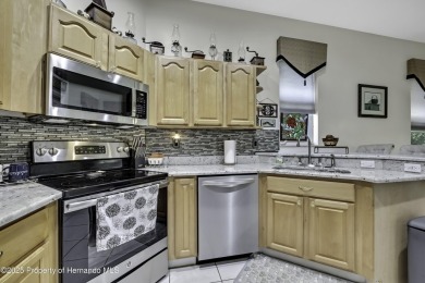 Such a beautiful home to enjoy from the gorgeous front door, and on Glen Lakes Country Club in Florida - for sale on GolfHomes.com, golf home, golf lot