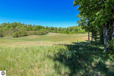 Beautifully wooded one acre lot with frontage on Champion Hill on Champion Hill Golf Club in Michigan - for sale on GolfHomes.com, golf home, golf lot