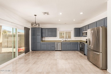 This spacious 5-bedroom home blends comfort, functionality, and on Wigwam Golf  Resort Litchfield Park  in Arizona - for sale on GolfHomes.com, golf home, golf lot