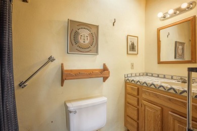 Charming Adobe Pumice Home with Expansive Mountain Views on Taos Country Club in New Mexico - for sale on GolfHomes.com, golf home, golf lot