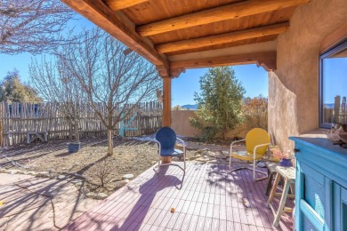 Charming Adobe Pumice Home with Expansive Mountain Views on Taos Country Club in New Mexico - for sale on GolfHomes.com, golf home, golf lot