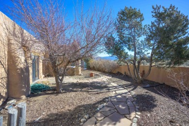 Charming Adobe Pumice Home with Expansive Mountain Views on Taos Country Club in New Mexico - for sale on GolfHomes.com, golf home, golf lot