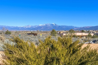 Charming Adobe Pumice Home with Expansive Mountain Views on Taos Country Club in New Mexico - for sale on GolfHomes.com, golf home, golf lot