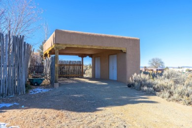 Charming Adobe Pumice Home with Expansive Mountain Views on Taos Country Club in New Mexico - for sale on GolfHomes.com, golf home, golf lot