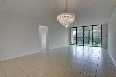 4th FLOOR CONDO WITH SOUTH EXPOSURE OFF THE SCREENED BALCONY on The Country Club At Boca Raton in Florida - for sale on GolfHomes.com, golf home, golf lot