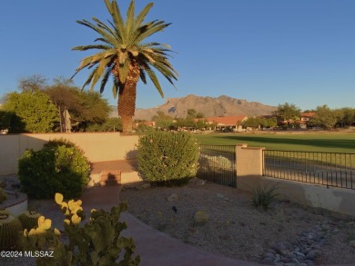 Nestled within the prestigious Omni Tucson National community on Omni Tucson National Golf Resort and Spa - Sonoran in Arizona - for sale on GolfHomes.com, golf home, golf lot