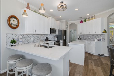 Tucked away on a quiet street with peaceful pond views, this on Heritage Springs Country Club in Florida - for sale on GolfHomes.com, golf home, golf lot