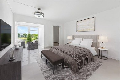 Enjoy easy living with stunning golf course views in the on Wynmoor Golf Course in Florida - for sale on GolfHomes.com, golf home, golf lot