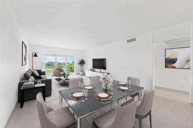 Enjoy easy living with stunning golf course views in the on Wynmoor Golf Course in Florida - for sale on GolfHomes.com, golf home, golf lot