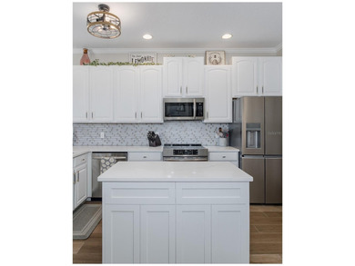 Tucked away on a quiet street with peaceful pond views, this on Heritage Springs Country Club in Florida - for sale on GolfHomes.com, golf home, golf lot