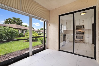 Beautifully remodeled 2/2 villae see this light and bright villa on Pine Tree Golf Club in Florida - for sale on GolfHomes.com, golf home, golf lot